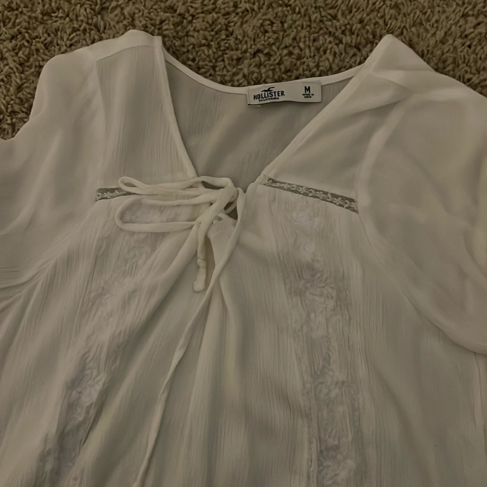 A long sleeve white blouse from Hollister. It is a size medium and never worn.